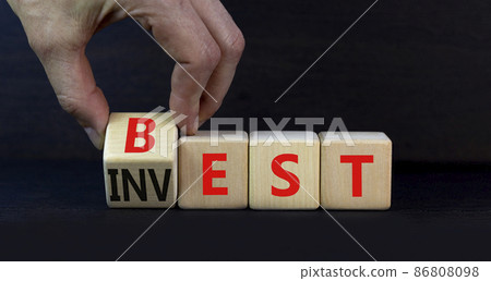 Best invest symbol. Businessman turns a wooden cube and changes the word Invest to Best. Beautiful grey table, grey background. Business and best invest concept. Copy space. Best invest symbol. Businessman turns a wooden cube and changes the word Invest to Best. Beautiful grey table, grey background. Business and best invest concept. Copy space. 86808098