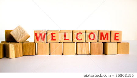 Welcome and support symbol. The concept word Welcome on wooden cubes. Beautiful white table, white background, copy space. Business, welcome and support concept. 86808196
