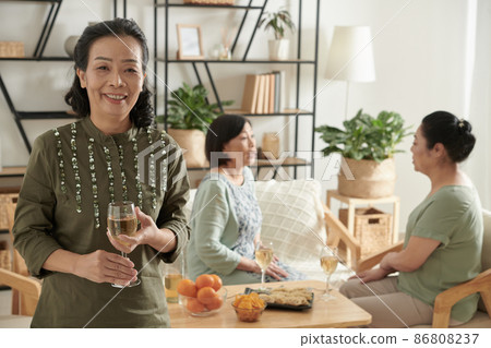 Aged Woman Drinking Champagne Aged Woman Drinking Champagne 86808237