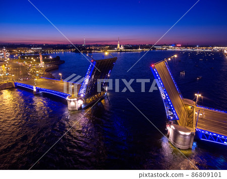 Aerial night landscape of festivities on palace embankment at bridge drawing in St. Petersburg, Russia, picturesque night illumination of landmarks, a lot of pleasure boats, a lot of people Aerial night landscape of festivities on palace embankment at bridge drawing in St. Petersburg, Russia, picturesque night illumination of landmarks, a lot of pleasure boats, a lot of people 86809101