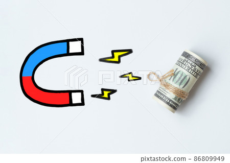 The concept of attracting investment. Abstract drawn magnet attracts money. The concept of attracting investment. Abstract drawn magnet attracts money. 86809949