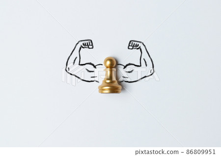 The concept of a business strong person. Arms muscles drawn with a pawn chess piece. The concept of a business strong person. Arms muscles drawn with a pawn chess piece. 86809951