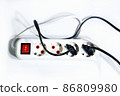 Extension cord with a button on a white background. Isolate. Copy space.View from above. Flat lay. 86809980