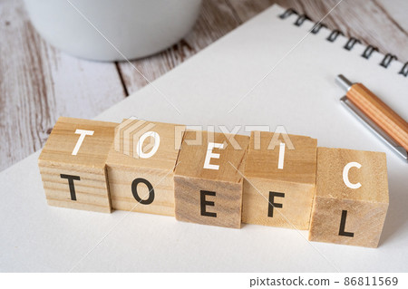 Building blocks, pens, notebooks, coffee cups with "TOEIC" and "TOEFL" written on them Building blocks, pens, notebooks, coffee cups with "TOEIC" and "TOEFL" written on them 86811569