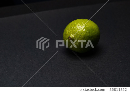 lime raw lemon tree branch hanging and black background 86811832