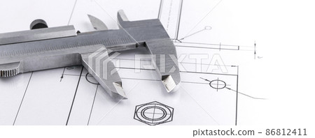 Old metal caliper and engineering drawing. 86812411