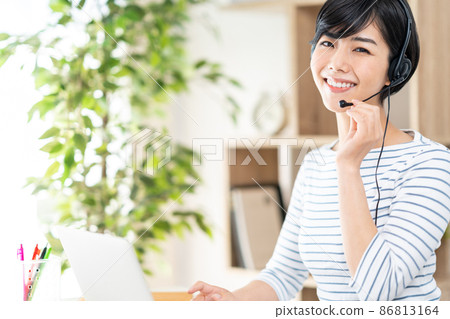 A woman doing telework in the living room A woman doing telework in the living room 86813164