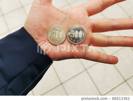 A 500-yen coin in the palm of your hand A 500-yen coin in the palm of your hand 86813362