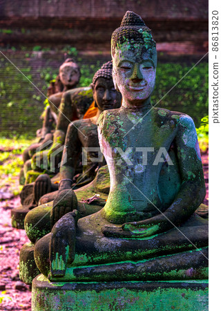 Ancient Wreckage Buddha Statue at U Mong Temple in Chiang Mai, Thailand. 86813820