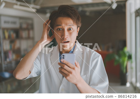 Doctor and smartphone Doctor and smartphone 86814216