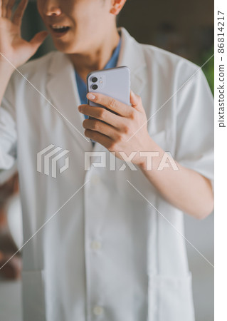 Doctor and smartphone Doctor and smartphone 86814217