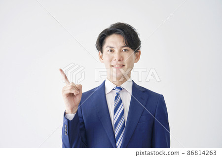 Businessman pointing white background Businessman pointing white background 86814263