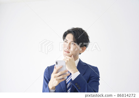 Businessman smartphone thinking white background Businessman smartphone thinking white background 86814272