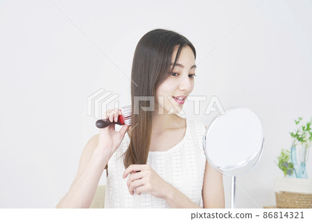 Female living room brushing Female living room brushing 86814321