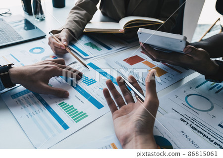 Analytics intelligence concept. Group of business people discuss current financial and economic on laptop for investment at the meeting. Analytics intelligence concept. Group of business people discuss current financial and economic on laptop for investment at the meeting. 86815061