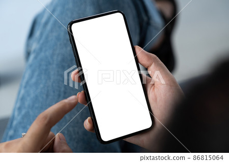 Mockup image of a woman using mobile phone and select something. Technology concept. Mockup image of a woman using mobile phone and select something. Technology concept. 86815064