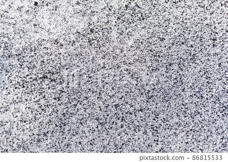 Black soot from the boiler room on white snow. Natural background. Snow mixed with coal soot, poor ecology. Environmental pollution  86815533