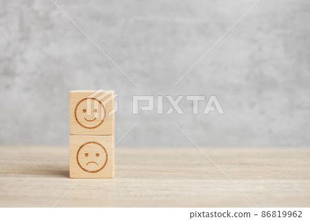 emotion face symbol on wooden blocks. mood, Service rating, ranking, customer review, satisfaction, evaluation and feedback concept 86819962