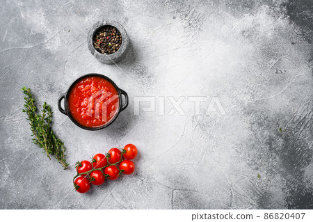 Homemade tomato sauce passata traditional recipe of italian cuisine, on gray stone table background, top view flat lay, with copy space for text Homemade tomato sauce passata traditional recipe of italian cuisine, on gray stone table background, top view flat lay, with copy space for text 86820407