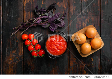 Tomato puree, on old dark wooden table background, top view flat lay, with copy space for text Tomato puree, on old dark wooden table background, top view flat lay, with copy space for text 86820432