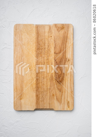 Wooden cutting board, on white stone table background, top view flat lay , with copy space for text or your product Wooden cutting board, on white stone table background, top view flat lay , with copy space for text or your product 86820618