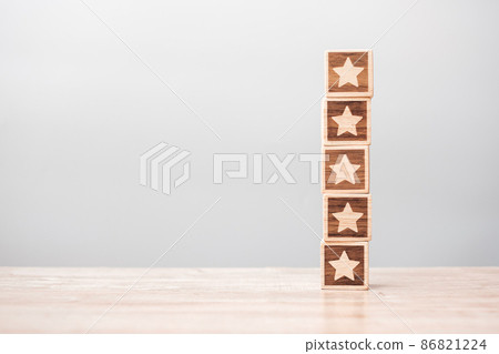star symbol block on table background. Service rating, ranking, customer review, satisfaction, evaluation and feedback concept star symbol block on table background. Service rating, ranking, customer review, satisfaction, evaluation and feedback concept 86821224