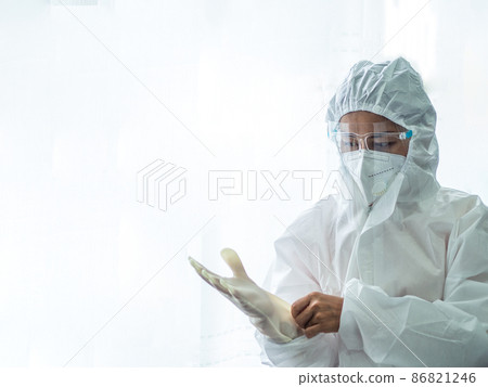 woman doctor in PPE (Personal Protective Equipment) for working in Covid19 ward 86821246