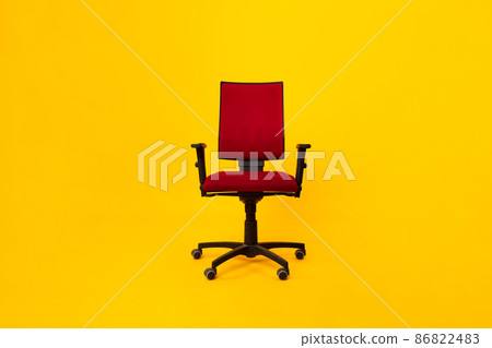 Front View Of Red Adjustable Office Chair Over Yellow Background Front View Of Red Adjustable Office Chair Over Yellow Background 86822483
