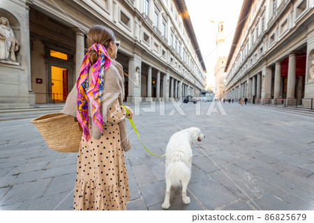 Woman visiting architectural landmarks of Florence city, Italy Woman visiting architectural landmarks of Florence city, Italy 86825679