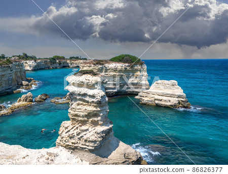 Melendugno,province of Lecce, Puglia, Italy. August 2021. The stacks of Sant'Andrea are a point of naturalistic attraction 86826377