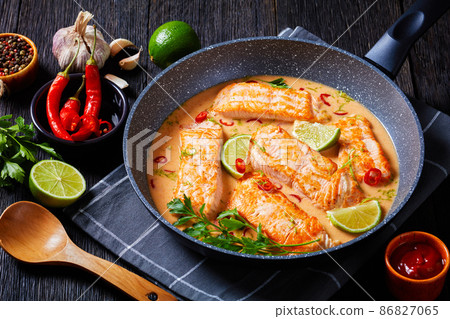Poached Salmon in hot Coconut Lime Sauce Poached Salmon in hot Coconut Lime Sauce 86827065