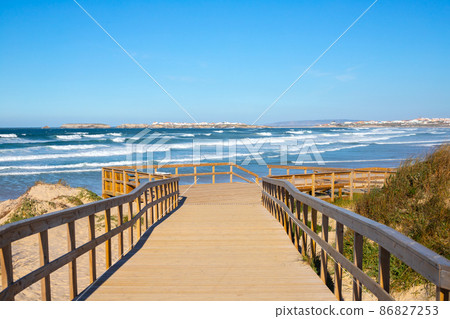 natural wooden walkway in Peniche, Portugal in day light natural wooden walkway in Peniche, Portugal in day light 86827253