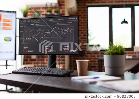 Close up of monitor with company growth analysis on office desk 86828005