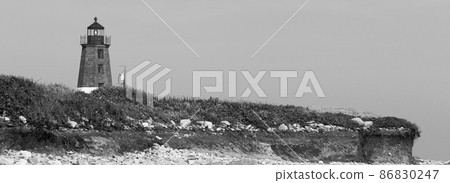 Black and White of the Point Judith Lighthouse above the sand rocks and snad dunes 86830247