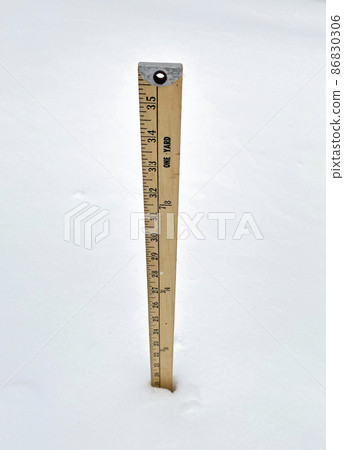 Yardstick measuring nineteen inches of snow Yardstick measuring nineteen inches of snow 86830306
