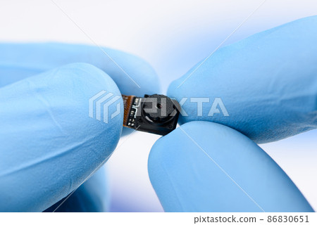 Camera module in scientist hands. 86830651
