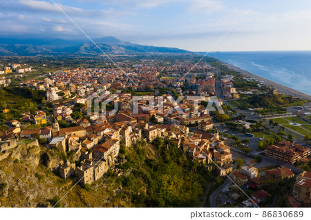 Aerial view of Scalea city and sea coast at sunset, province of Cosenza, Calabria region, Italy. 86830689