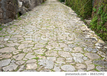 Beautiful cobblestone road in Kinjo Town, Naha City 86832942