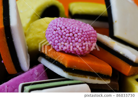 Den Helder, Netherlands. January 2022. Different kinds of english licorice in different colors. Den Helder, Netherlands. January 2022. Different kinds of english licorice in different colors. 86833730