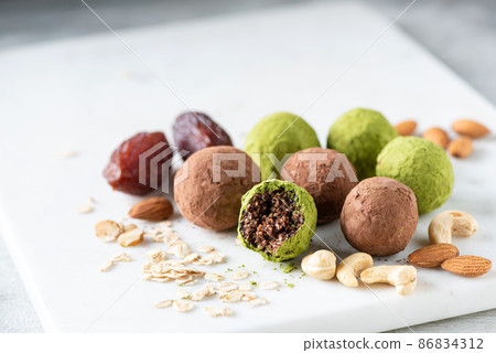 Healthy energy balls with dates and nuts Healthy energy balls with dates and nuts 86834312