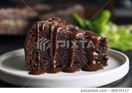Slice of chocolate cake with glaze Slice of chocolate cake with glaze 86834317