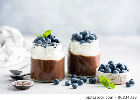 Vegetarian chocolate pudding with yogurt and blueberries Vegetarian chocolate pudding with yogurt and blueberries 86834319