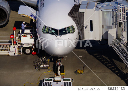 Airport plane, ground worker, airfield scenery Airport plane, ground worker, airfield scenery 86834483
