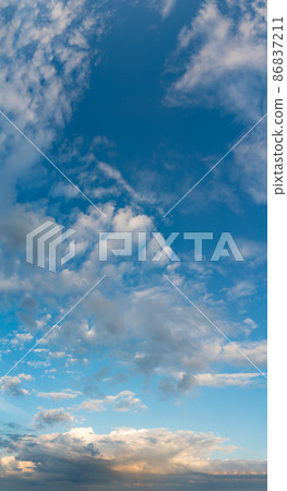 Fantastic clouds at sunrise, vertical panorama 86837211
