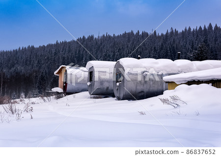 shift camp with cylindrical portable buildings in the winter northern taiga 86837652
