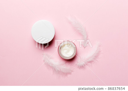 Spa cosmetic product, cream jar, branding mock up, top view with feathers background. Flat lay Spa cosmetic product, cream jar, branding mock up, top view with feathers background. Flat lay 86837654