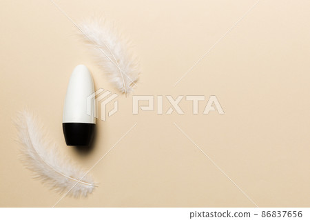 Set of skin care serums on pink pastel background with ostrich feathers. Spa cosmetic product, cream jar, branding mock up, top view with copy space Set of skin care serums on pink pastel background with ostrich feathers. Spa cosmetic product, cream jar, branding mock up, top view with copy space 86837656