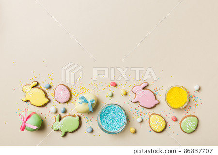 holiday preparation Multi colors Easter eggs with cookies on colored background . Pastel color Easter eggs. holiday concept with copy space 86837707