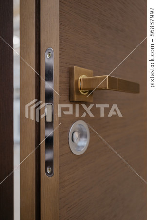 Door knob. Stainless steel door handle.Lockable front door handle.Interior design concept.Entrance door 86837992