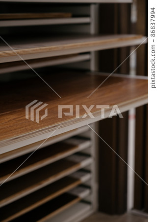 Laminate background. Samples of laminate or parquet with a pattern and wood texture for flooring and interior design. Production of wooden floors Laminate background. Samples of laminate or parquet with a pattern and wood texture for flooring and interior design. Production of wooden floors 86837994